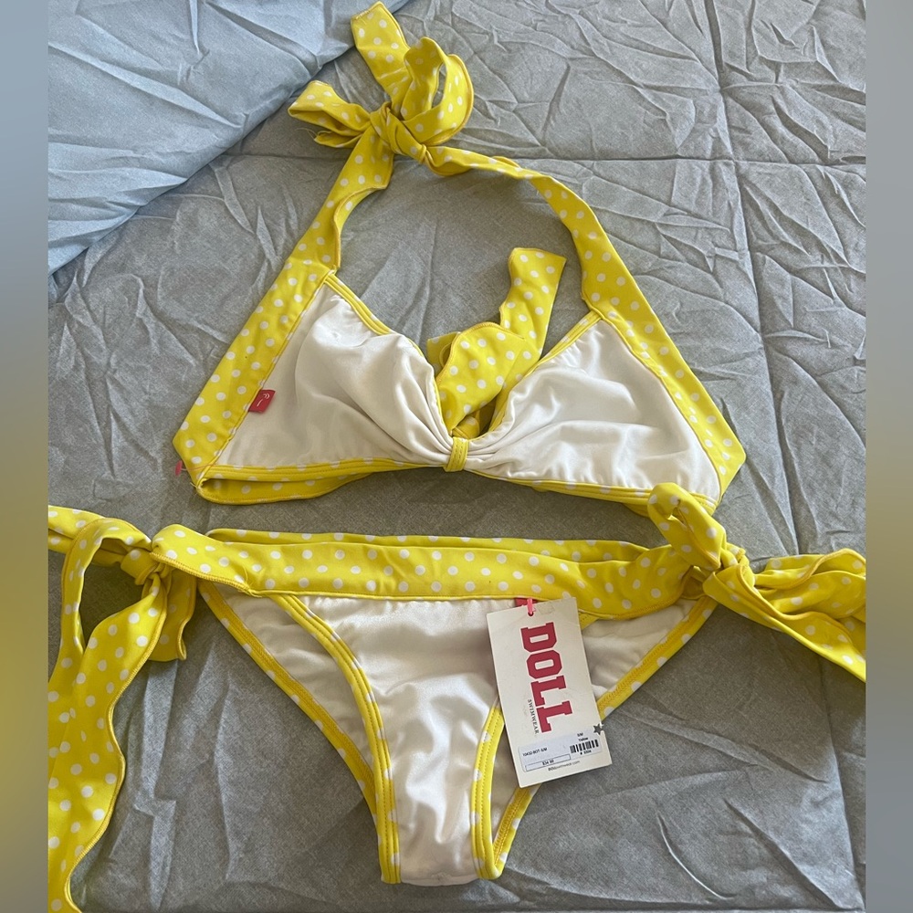 Chynna dolls matching two piece set yellow and white polka dot wavy trims.